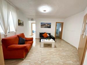 a living room with a couch and a table at Boutique Apartment by the Sea in Alicante