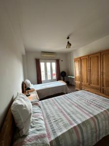 A bed or beds in a room at Deluxe room in Degla,Maadi