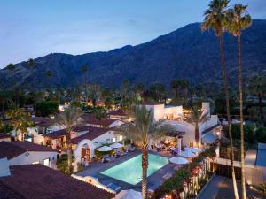 an aerial view of a resort with a pool and palm trees at La Serena Villas, A Kirkwood Collection Hotel in Palm Springs