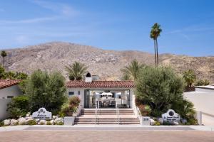 a home in the desert with a mountain in the background at La Serena Villas, A Kirkwood Collection Hotel in Palm Springs