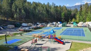 an aerial view of two tennis courts at Akiskinook Resort on Lake Windermere - 1 Bedroom Condo - Sleeps 4 - Indoor Pool - Hot Tub - Sandy Beach - Hot Springs - Golf - 12 Courses - Walk to Town - Shopping - Dining - Local Pubs in Invermere