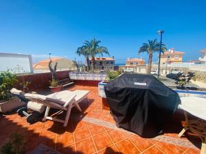 a patio with a picnic table and a tent at Villa Ivanlore in Las Palmas de Gran Canaria