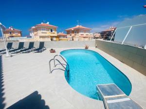 a swimming pool on the roof of a house at Villa Ivanlore in Las Palmas de Gran Canaria
