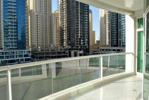 a balcony with a view of a city with tall buildings at Amazing View I 1min Walk to Marina Mall I Close to Beach in Dubai
