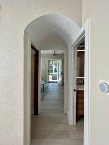 a hallway with an archway in a house at Arianna's Modern Makeover in Grand Rapids