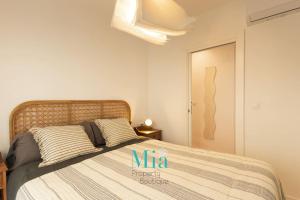 Postel nebo postele na pokoji v ubytování City and Beach Apartment