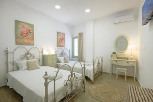 Giường trong phòng chung tại Arethousa House +62 ảnh