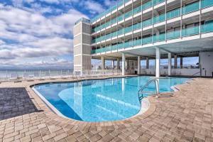 a swimming pool in front of a building at Fontainebleau Terrace 223 in Panama City Beach