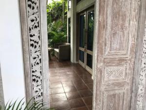 an open door to a room with a porch at Bangsring Breeze in Banyuwangi