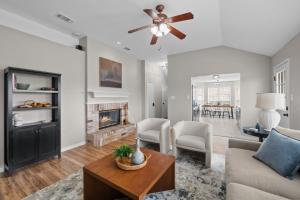 a living room with a couch and a fireplace at Modern Home Close to It All in DFW Texas! in Grand Prairie