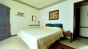 Ein Bett oder Betten in einem Zimmer der Unterkunft Apartments in Villa Isabel