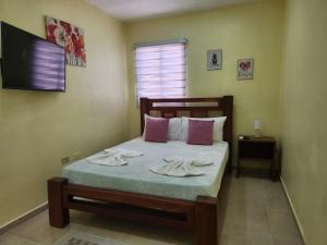 Postel nebo postele na pokoji v ubytování Apartamentos Melya cerca de la Playa Caleta