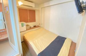 Postel nebo postele na pokoji v ubytování Tabist Hotel Aurora Ikebukuro