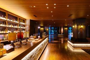 a bar in a hotel with a long counter at TAOYA Akiu in Sendai