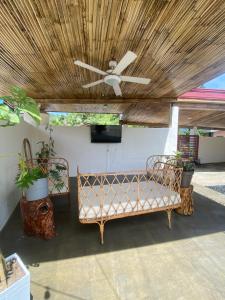 a patio with two benches and a ceiling at Entire Villa near Surigao City in Surigao