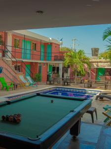 a pool table in the middle of a swimming pool at Hostel Nirvana Taganga in Taganga +73 photos