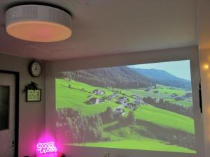 a large window with a picture of a golf course at Wayado Sapporo Ciao in Sapporo