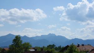 a view of mountains and houses in a city at Chiemgauloft am Chiemsee in Übersee