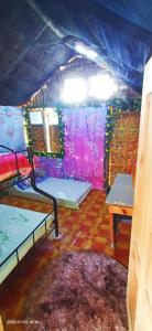 a room with two bunk beds and a table at IYAMAN FARM near SAGADA 