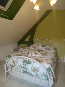 Ένα ή περισσότερα κρεβάτια σε δωμάτιο στο Le domaine d Estelle