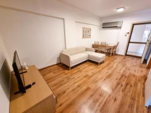 TV a/nebo společenská místnost v ubytování CityCenter Apartment