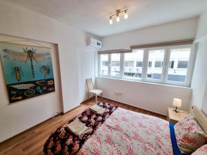Postel nebo postele na pokoji v ubytování CityCenter Apartment