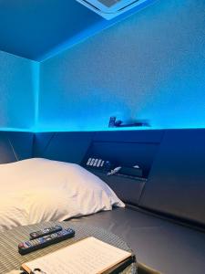 Postel nebo postele na pokoji v ubytování Asokono Hotel