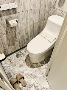 Koupelna v ubytování Asokono Hotel