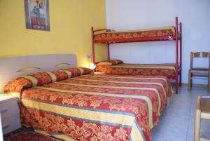 Postel nebo postele na pokoji v ubytování Hotel Ragno