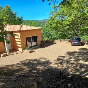 a car parked in front of a house at Villa Castellane in Bauduen