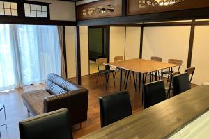 a conference room with a table and chairs at 宮島 玖波宿 - GR Residence Kuba inn - 
