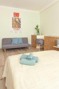 a room with a bed and a couch in it at Vysoká Apartman EMF/STP in Bratislava