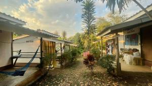 a house with a hammock in front of it at Sun Moon Pai Bungalow in Pai