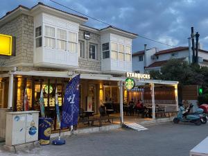 a store front of a building with a restaurant at Alacati Moonbox Hotel in Alacati