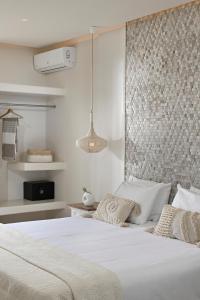 Cama ou camas em um quarto em Erato Hotel Mykonos