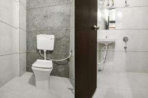 a bathroom with a toilet and a sink at FabExpress SP7 in Indore