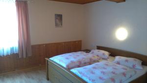 a bedroom with a bed and two pillows on it at Gartenblick in Brotterode