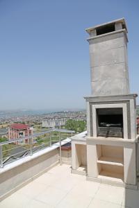 a fireplace on the roof of a building at Memory Suites in Buyukcekmece