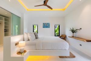 a white bedroom with a white bed and a ceiling at Villa Mandra 4BR Luxury Pool Villa, Bophut KBR2 in Koh Samui  +92 photos
