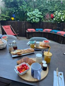 a table with bread and other food on it at BOCAL DE BAGES Chambre D'hôtes in Bages