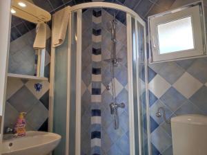 a bathroom with a shower and a sink at Apartment Rose in Krk +53 photos