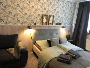 Кровать или кровати в номере Ferienhaeuschen-Duderstadt