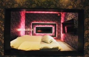 Postel nebo postele na pokoji v ubytování Asokono Hotel