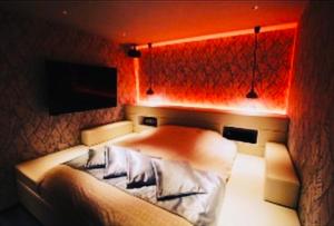 Postel nebo postele na pokoji v ubytování Asokono Hotel