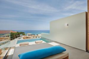 a view of the ocean from the balcony of a house at Tsamis Zante Suites in Kipseli