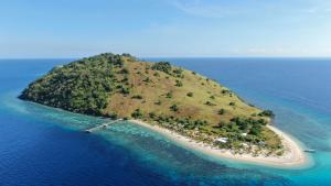 an island in the middle of the ocean at Le Pirate Island - Adults Only in Labuan Bajo