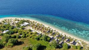 an aerial view of a beach and the ocean at Le Pirate Island - Adults Only in Labuan Bajo