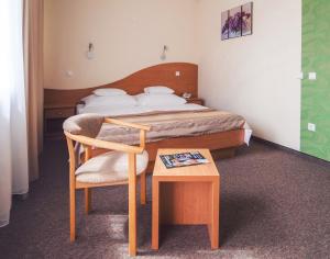 A bed or beds in a room at Granada Conference, Wellness and Sport Hotel