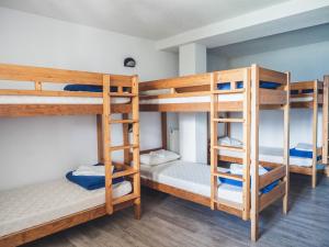 a bunk bed room with three bunk beds at Auberge Le Valezan in Valezan