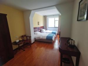 Postel nebo postele na pokoji v ubytování Beidaihe No. 3 Jinhai